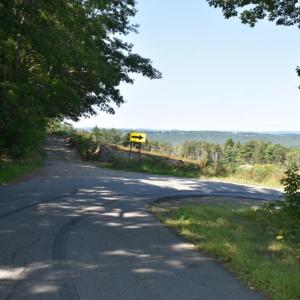 A tight blind corner at the top of a hill make for very slow vehicular traffic on this narrow road. (Photo by Sarah Thompson)
