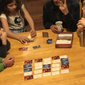 A group enjoying a game of Codenames. Photo courtesy Boardgame Cafe