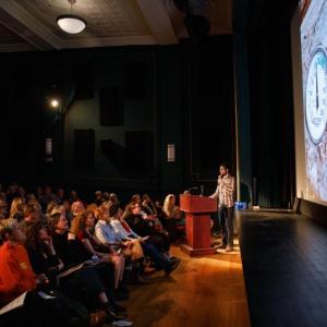 Aaron Englander presents at the April 2024 Pecha Kucha Night at the Strand Theatre. (Photo by Michael O’Neil) Aaron Englander presents at the April 2024 Pecha Kucha Night at the Strand Theatre. (Photo by Michael O’Neil)
