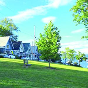 The picturesque gingerbread houses along Park Row Road sit facing the Temple Heights section of Bayside, which remains a popular gathering place. (Photo by Erica Thoms)