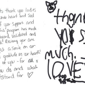 Thank you note to Finding Our Voices. Patrisha McLean, CEO and Founder of Finding Our Voices, flanked by the nonprofit’s Chief of Staff Mary Kamradt  (right) and Patrisha’s daughter and Finding Our Voices volunteer Jackie McLean Strack. Jackie is featured in the group’s poster campaign referencing abuse by her father. She also provides the music for Patrisha’s Podcast “Let’s Talk About It”.  (Photo courtesy Finding Our Voices)