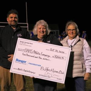 Lions Karen Varney and current president Michele Leach present the donation check to BAHS Principal Jeff Lovejoy. (Photo courtesy Charles Lagerbom)