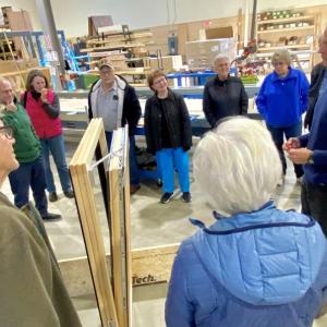 GO Logic CEO Alan Gibson describes window construction to tour participants. (Photo courtesy Martha Laitin)