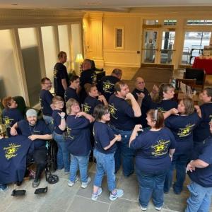 Teammates from Bank of America Belfast Support Services show off their custom 25-year anniversary T-shirts during the celebration at the Belfast financial center in August 2024. (Photo courtesy Bank of America)