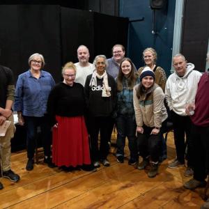 (l-r) Jordan Smith, Wendy Wincote Schweikert, Stephane Natale Frus, Brandon Muggy, Ivy Lobato, Gwyneth Sauvage, Cassidy Small, Alison Trejo (front), Kelly Gubbels, Doug Goodman, and James Reitz. (Photo courtesy Belfast Maskers)
