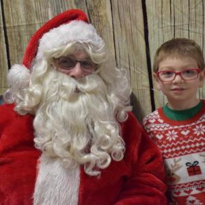 Anthony Diaz poses with Santa during Thomaston Grammar School's annual Cookies with Santa event. (Photo courtesy Thomaston Grammar School)