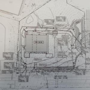 Application paperwork shows the site location.