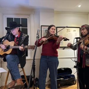 Rosey, Corrine, and Lise play traditional Christmas music. Music