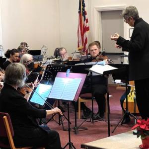 Conductor Deirdre McClure conducts orchestra. (Photo courtesy Penobscot Bay Orchestra)