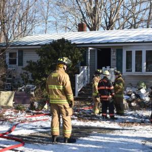 Long after the smoke cleared, interior-trained firefighters continued to clean debris, saturate hot spots, and search for the origin of the fire at 906 Depot Road, in Union. (Photo by Sarah Thompson)
