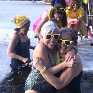 This hug at last year's “Love Ourselves” cold water dip exemplifies the love and community Finding Our Voices is bringing to Maine women with its February events, according to FOV, in a news release. Hugging at 2024’s Wander Women’s dip in Union are Carla Armbuster and Carol Miller. Back (l-r): Cathy Kelly, Kerry Hadley, Emily Peckham, and Laura Cabot. (Photo by Erja Lipponen)