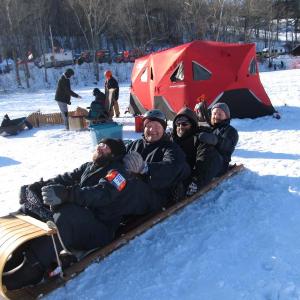 Members of Big Ash Sled practicing the full tuck. Photo by Kay Stephens
