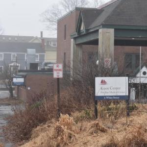 Looking toward Limerock Street at the healthcare signs for 6 White Street (foreground) and 4 White Street in the rear. (Photo by Sarah Thompson)