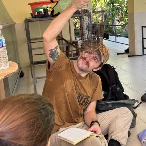 Eric Brown checks out a recently-acquired squirrel. (Photo courtesy Merryspring Nature Center)
