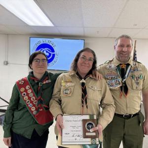 District Award of Merit recipient Yvette Robichaud Bernier with her daughter Paige Spears and husband Christopher Bernier.  Paige is a member of Scouts Canada and earned Scout Canada’s Chief Scout Award. Chief Scout is the highest rank in the Scouting section of Scouts Canada, making it equivalent to Eagle Scout in Scouting America or Gold Award in Girl Scouts. (Photo courtesy Chuck Mahaleris)