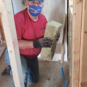 Rotarians regularly contribute to Habitat efforts, improving the energy efficiency of existing spaces. (Photo courtesy Midcoast Habitat for Humanity)