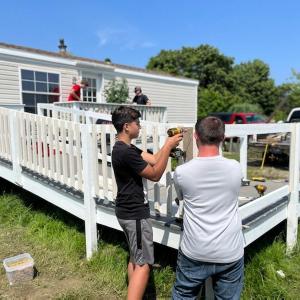 High School students address accessibility issues for an elderly homeowner. (Photo courtesy Midcoast Habitat for Humanity)