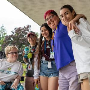 In 2024, Pine Tree Camper Cassie Oakes (Alexander, ME) spent a barrier-free week of fully accessible summer camp on the shores of North Pond making new friends and spending time with counselors from Maine and abroad, including: Brandi Place (Morrill, ME), Daniela Ochoa-Diaz (Rionegro, Colombia), Lauren Grant (Gardiner, ME) and Marina Rodriguez (Andalusia, Spain). On Saturday, May 17, parents, families and caregivers are invited to meet the team and experience Pine Tree Camp first hand. More information at w