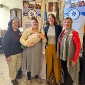 Healthy Kids' educators Toby Lecrone (Knox), Sofie Watts (Lincoln) and Executive Director Char Corbett (right) stand with Rep. Lydia Crafts at the State House Hall of Flags on April 2 to kick off Child Abuse Prevention Month with the state’s Prevention Councils. (Photo courtesy Healthy Kids)