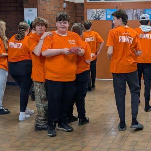 Runners ready to deliver problems to the floor. (Photo by Elias Twitchell)