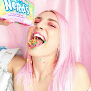Girl eating nerds candy