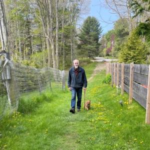 Camden resident Richard Benner walks with his dog along the path proposed for municipal purchase. (Photo courtesy Geoff Scott) c