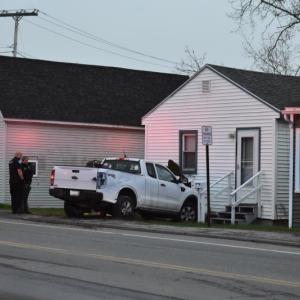 A pickup truck hits a house on Main Street in Rockland, Friday, May 2, 2025. (Photo by Sarah Thompson)