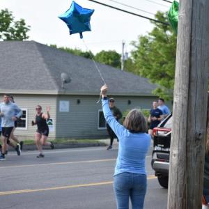 Maine State Credit Union workers rally for Special Olympics during the 2024 Law Enforcement Torch Run for Special Olympics. (Photo by Sarah Thompson)