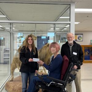 Belfast Peer Leadership LEO vice-president Story Carlson presents the check to the But Still I am One directors in the Belfast Area High School lobby. (Photo courtesy Charles Lagerbom) Belfast Peer Leadership LEO vice-president Story Carlson presents the check to the But Still I am One directors in the Belfast Area High School lobby. (Photo courtesy Charles Lagerbom)