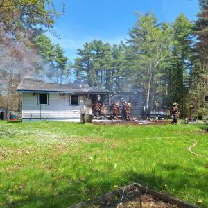 The house located at 327 West Street was heavily damaged by a fast- moving fire on May 13 that began around 12 p.m. (Photo by Sarah Shepherd) c