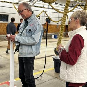 Dave Morrison, Camden's Opera House directorm, reads the voting results at the Camden Fire Station after the town voted June 10. (Photo by Lynda Clancy) c