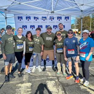 The Dow Furniture Team supported the Travis Mills Foundation—honoring veterans, their families, and those who made the ultimate sacrifice—at the Miles for Mills 5K. Pictured left to right: Wilmot Dow, Elise Wallace, Lisa Dow, David Kolarik, Travis Mills, Rebecca Norton, Matthew Norton, Randy Joubert, Rebecca Wylie. (Photo courtesy Dow Furniture) 