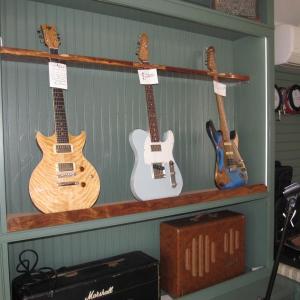Guitars for sale at String Theory. Photo by Kay Stephens