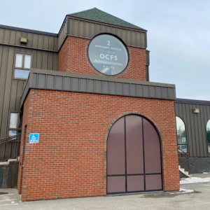 Photo by Stephanie McFeeters. exterior of the office of child and family services building.