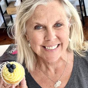 Vicki Murray with the “Into the Light!” lemon cupcake at Laugh Loud, Smile Big in Camden. Murray writes about transcending physical and emotional abuse by her first husband in her new book "Cupcake Lady". (Photo by Patrisha McLean)