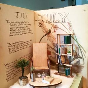 A Cozy Book Nook featuring a 1906 illustrated diary as the backdrop. (Photo courtesy Tonic of the Woods)