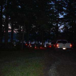 A narrow camp road is illuminated by taillights at 4:15 a.m. (Photo by Sarah Thompson)