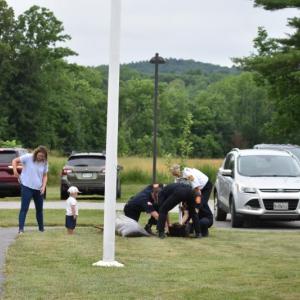 One of Keller's grandchildren watches with interest as Camden firefighters plant their gift to Keller of an apple tree in hopes of a fruitful future for HVFD. (Photo by Sarah Thompson)