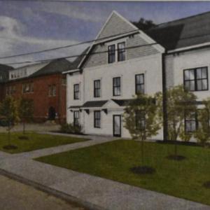 Artist rendering of a 2.5 story apartment structure proposed for 82 Summer Street and the rear of the McLain Building at 28 Lincoln Street. (Image included in application packet)