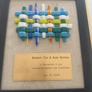 Eastern Tire award. (Photo courtesy PAWS Animal Adoption Center)