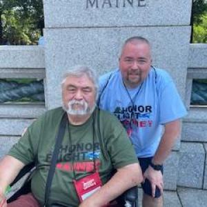 Danny L. Swindler poses with his son, Danny, at the Maine sign. (Photo courtesy Danny Swindler/Dawn Bailey)