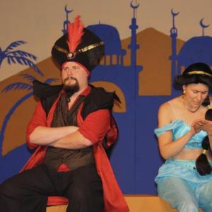The misunderstood Royal Vizier Ja'Far (Dakota Wing, left) attends to his young ward, the princess (Linnea Harrold). (Photo by Maci Burgess)