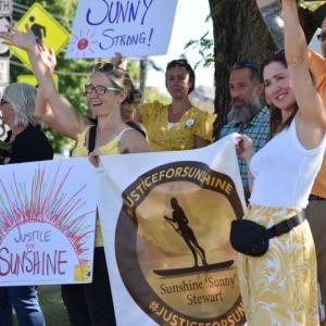 Friends and family of Sunshine Stewart get support from motorists following the first real proceeding of Stewart's July  2, 2025 homicide. (Photo by Sarah Thompson)