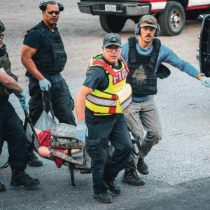 Carrying patients from the hot zone to the warm zone. (Photo courtesy Connor Howland/Camden Fire Dept.)