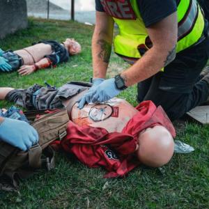 Applying bandages to a chest wound. (Photo courtesy Connor Howland/Camden Fire Dept.)