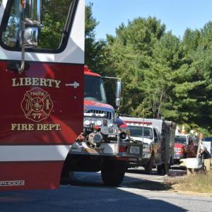 Several fire trucks line Route 220 in Liberty. (Photo by Sarah Thompson)