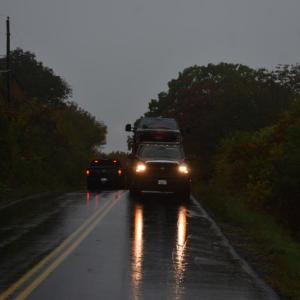 Tow truck with vehicle on back