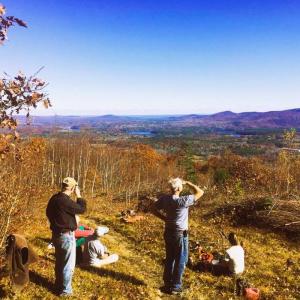 People admire the view from the top of a mountain