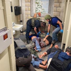Applying tourniquets and preparing to move patients from the hot zone. (Photo courtesy Matt Heath/Camden Fire Dept.) 