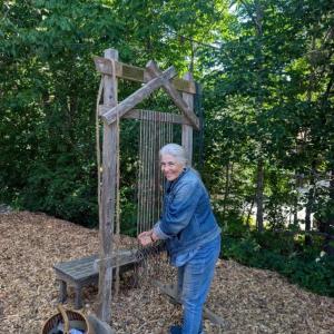 Susan Barrett Merrill warping an Earth Loom. (Photo courtesy Rockport Public Library)